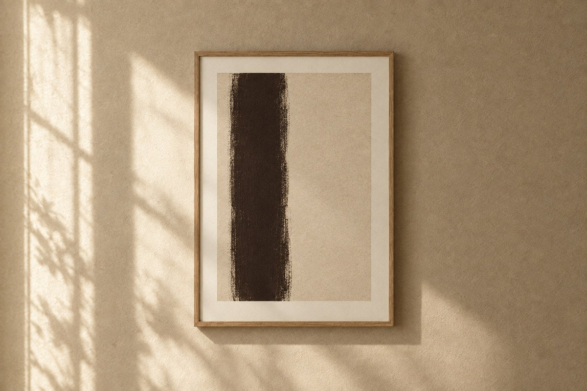 Basalt Framed Print — A dark espresso column standing off-centre on an unbleached ground
