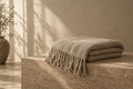 Alder Sherpa Throw in soft daylight against warm plaster