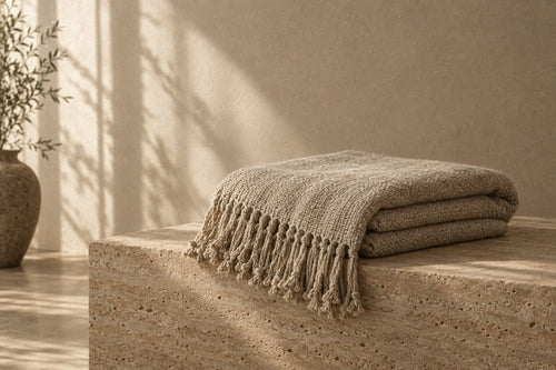 Alder Sherpa Throw in soft daylight against warm plaster